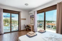 Kolymbia Village Hoteles cerca de Playa Tsambika