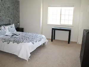 3 queen beds, 1 twin bed, 2 rooms, 1 and a half bath, self check-in, flexcation equipped