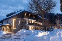 Aparthotel Familiaris - Family Apartments - Pools & Spa in Dolomites