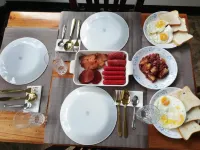 Balai Mariacaria Pension House Hotels in Guindulman