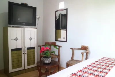 The Homey Rooms and Tours Hotel dekat Madad Sekumpul