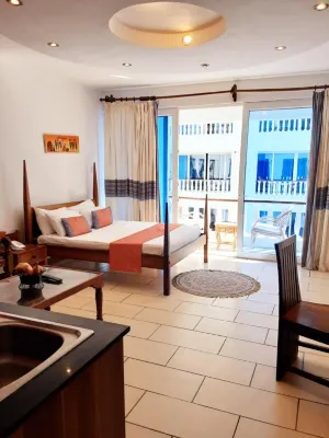 Cowrie Shell Beach Apartments Official Hotels in Bamburi Beach