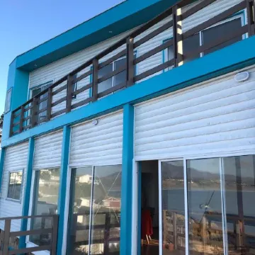Bahía Luz Hostal Отели в г. Конкон