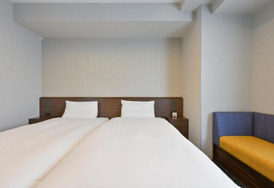 VIA INN OKAYAMA의 모던한 트윈룸