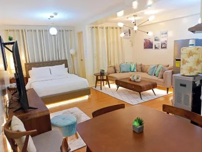 Spacious 36Sqm Studio with 65" TV Netflix Karaoke and Pool Access Near Airport and Samal Ferry Hotels in 