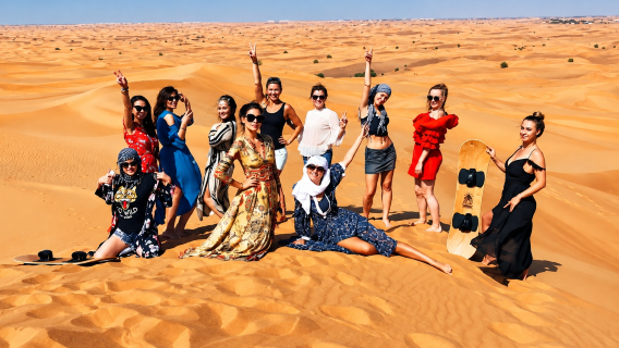 Abu Dhabi Desert Safari with Central & Hotel Pickup, Dinner, Live Shows and SandBoarding