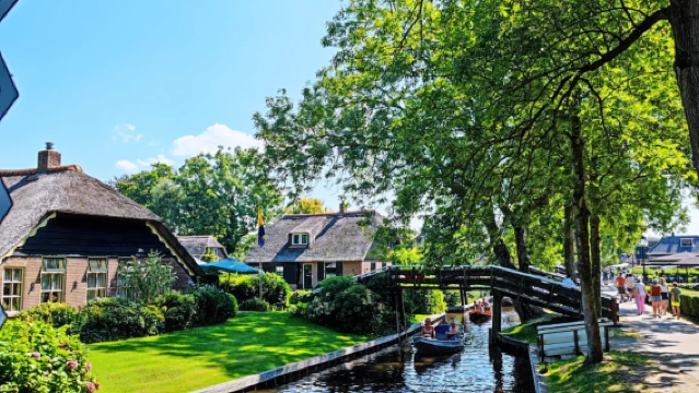 荷蘭阿姆斯特丹+桑斯安斯風車村+羊角村+德哈爾古堡一日遊