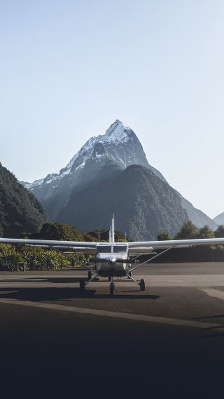 Queenstown round-trip + scenic flight + Milford Sound / Piopiotahi cruise with guaranteed window seat
