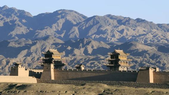 Jiayuguan Guancheng + The Great Wall pier + Hanging Great Wall day tour. Majestic pass reflects snow, beacon pier on sheer cliffs