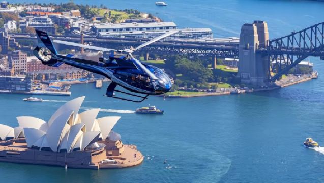 Vuelo turístico en helicóptero por Sídney, Australia [Recogida en el punto de encuentro urbano | Sobrevuela el Puente del Puerto y la Ópera de Sídney | Opción de salidas en grupo abierto o chárter privado]