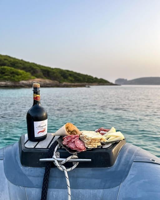 Alghero: boat tour with aperitif at sunset Porto Conte