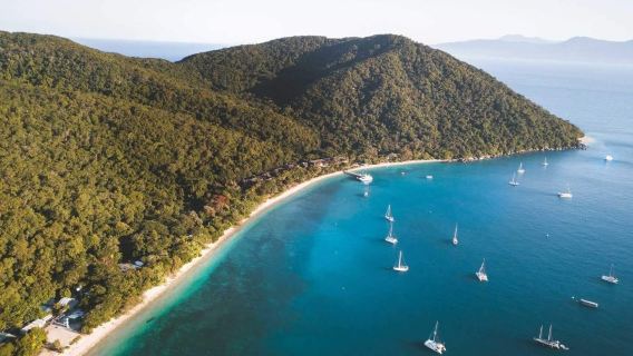 Round-trip boat ticket between Cairns and Fitzroy Island, departing at 8:00 and returning at 17:00, with daily departures