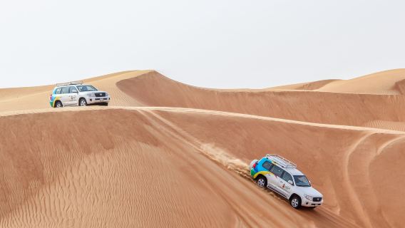Safari mattutino nel deserto di Dubai con giro in cammello e sandboarding