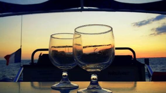 Sailing cruise on a Catamaran at aperitif time from La Rochelle