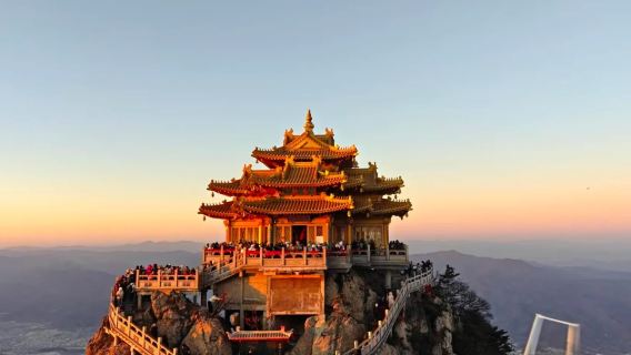 Night view available with door-to-door pickup for 3-8 people via shared transfer - Pure play day tour to Laojun Mountain's Miles Painted Screen and Golden Summit.
