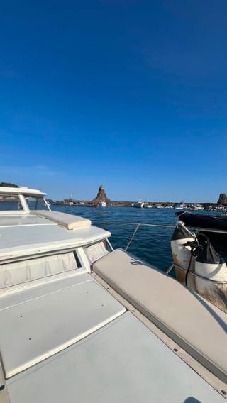 Boat tour in Acitrezza with stops for swimming