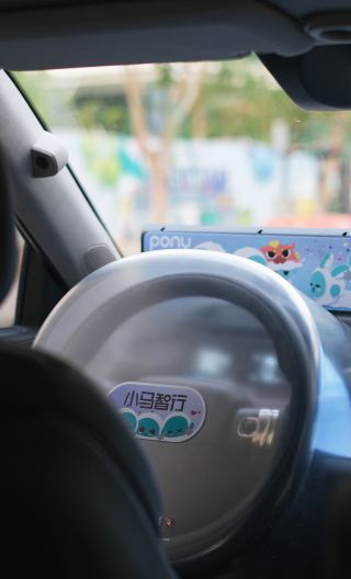 Guangzhou: Self-Driving Robotaxi Experience with Guide