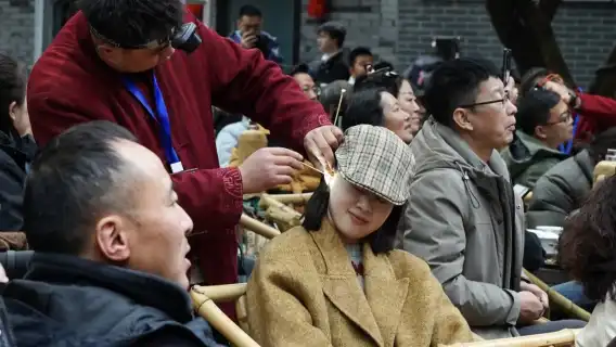 Experience the laid-back lifestyle of Chengdu with a traditional ear cleaning session at Shuxiaojiang.