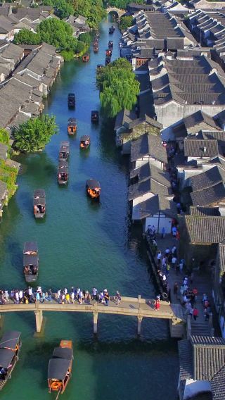 One-Day Tour from Hangzhou: Wuzhen East Scenic Zone + West Scenic Zone Night View (Ink-Wash Dawn & Dusk, Waterfront Light & Shadow)