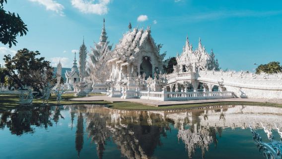 Thailand Chiang Rai Wat Rong Khun - White Temple, Wat Rong Suea Ten - Blue Temple, and Baan Dam Museum day tour (optional add-ons: Long Neck Karen tribe, Golden Triangle)