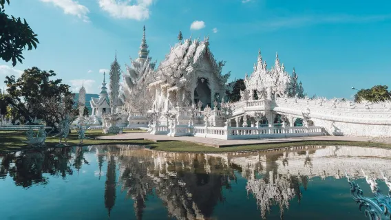 Thailand Chiang Rai Wat Rong Khun - White Temple, Wat Rong Suea Ten - Blue Temple, and Baan Dam Museum day tour (optional add-ons: Long Neck Karen tribe, Golden Triangle)