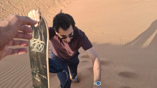 Dubai Desert Camp Experience: Standard Red Dune Desert Safari, Sand Boarding, and Buffet Dinner 7