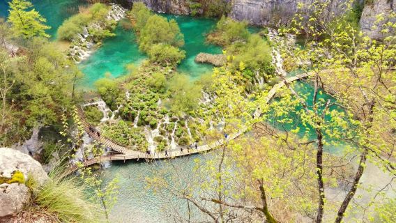 Plitvice Lakes: Walk between waterfalls and take boat ride