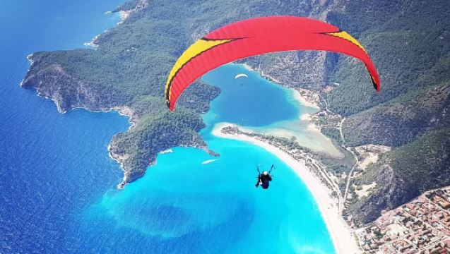 Fethiye paragliding flight experience [Mediterranean summit + aerial panorama + sea view + paragliding adventure]