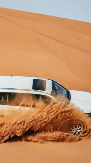 Desert Safari Dubai, Camel Riding, Sandboarding & BBQ Buffet Dinner
