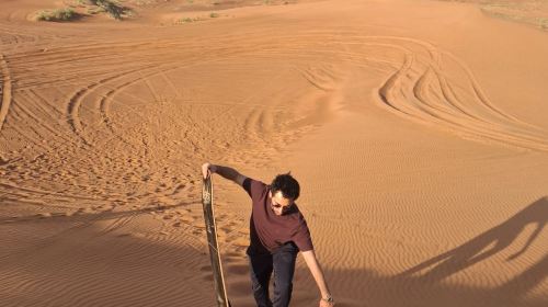 Dubai Desert Camp Experience: Standard Red Dune Desert Safari, Sand Boarding, and Buffet Dinner 8