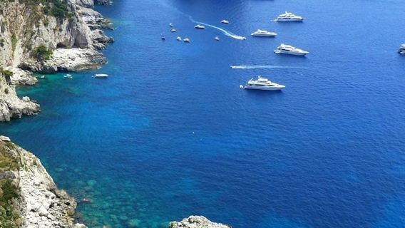 Capri: Boat Tour & Swimming Stop + Roundtrip from Naples