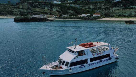 From Tropea sunset boat tour to Capo Vaticano with aperitif