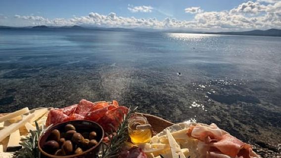 Golfo Aranci: transparent or traditional kayak, dolphins, and aperitif