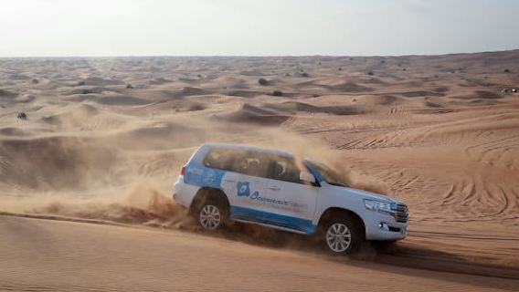 Abu Dhabi desert safari with BBQ, camel ride and sandboarding