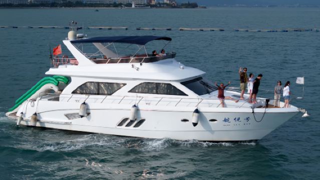 Huizhou East Bay Yacht: 68-foot three-deck luxury yacht charter for corporate team building and gatherings, including fun sea fishing, driving experience, water slide, and magic carpet.