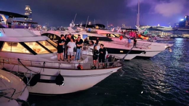 Hong Kong Yacht Sharing · Night Cruise to See the Stunning Victoria Harbour Night View and Fireworks Show