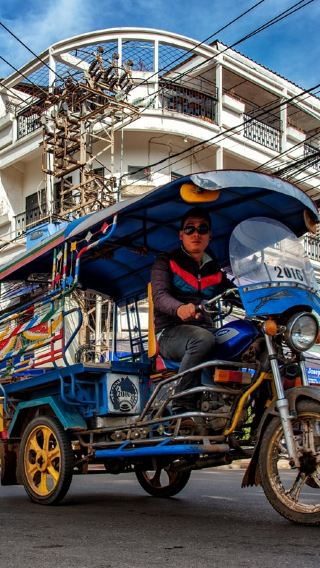 Discover Laos like a Local by a classic open-air tuk-tuk