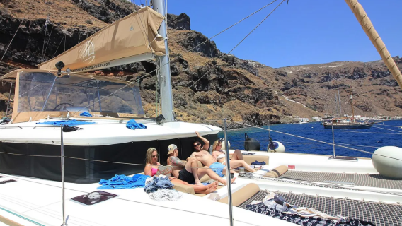 Santorini luxury sunset cruise with dinner, drinks and transfer service