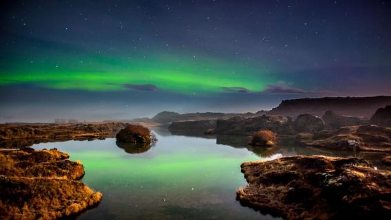 Akureyri: Northern Lights Hunt with Forest Lagoon Entry