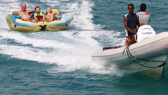 Egypt Red Sea triathlon parasailing banana boat flying fish Speedboating out to sea coral fish