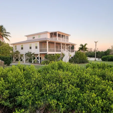 Large home on private penninsula with waterfront and views on three sides.