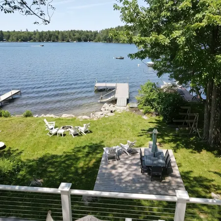 Relax in Raymond's lakefront 2-bedroom vacation home, just steps to Sebago Lake