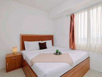 Serene and Warm 2BR at Apartment Bassura City By Travelio