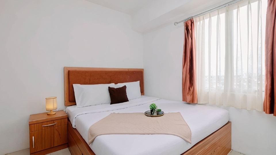 Serene and Warm 2BR at Apartment Bassura City By Travelio