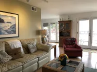 Beachfront home directly across from beach & park! Close to everything!