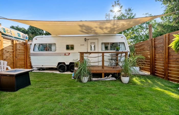 Renovated 1970’s retro camper on Bayou Grande in Pensacola with walking trail.