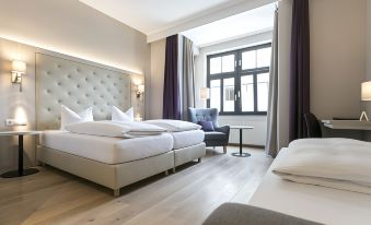 a modern hotel room with wooden flooring , white walls , and large windows , featuring a comfortable bed , nightstands , and a window with purple at Hotel Sailer