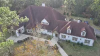 Escape to this serene 4-bedroom home set on 10 private acres.