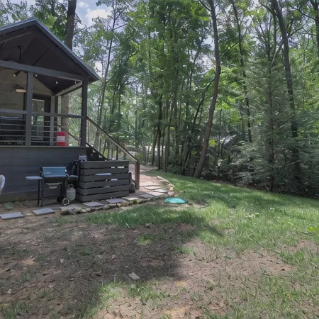 Nesthaven: A cozy boho-chic tiny home with a deck, fire pit, & nearby waterfall