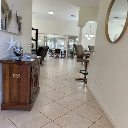 Great location..Climate-controlled lanai & NEW 2024 4-SEATER GOLF CART INCLUDED!